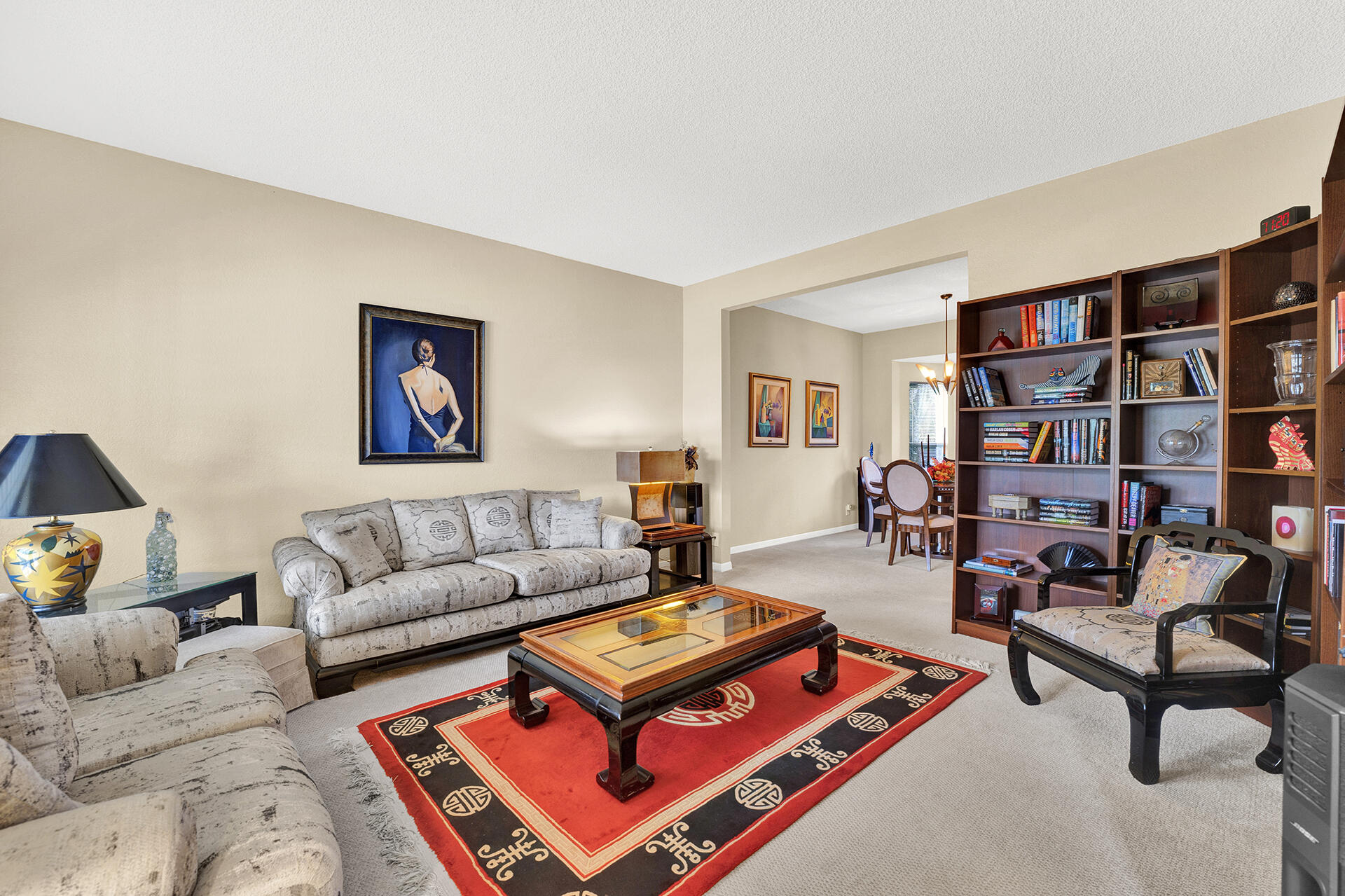 22211 Clocktower Way Boca Raton, FL 33428 - Photo 8 of 38 a living room with furniture and a book shelf