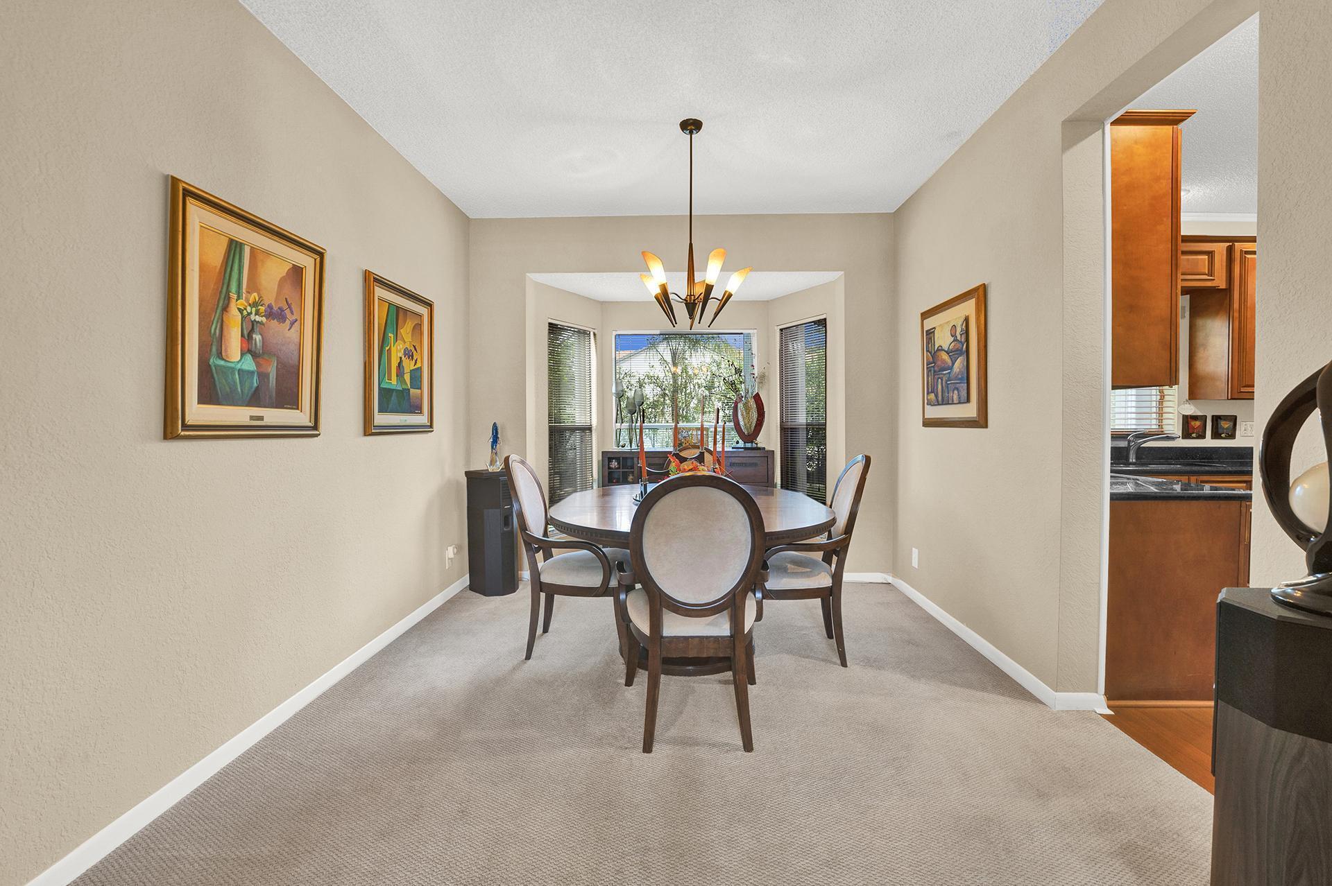 22211 Clocktower Way Boca Raton, FL 33428 - Photo 10 of 38 a dining room with furniture and window