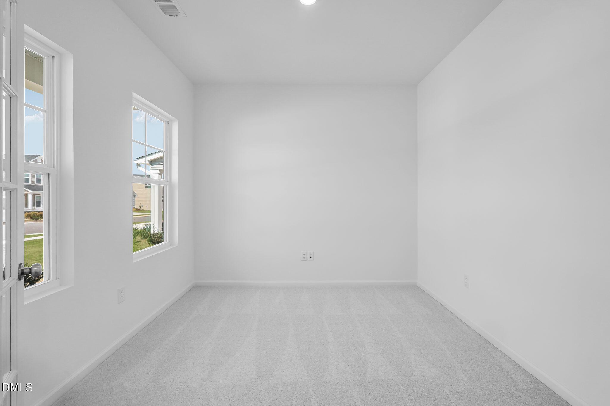 5818 Millstone Way Sims, NC 27880 - Photo 16 of 24 an empty room with windows