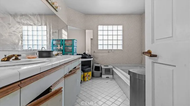 a view of a kitchen with a sink and dishwasher next to a window