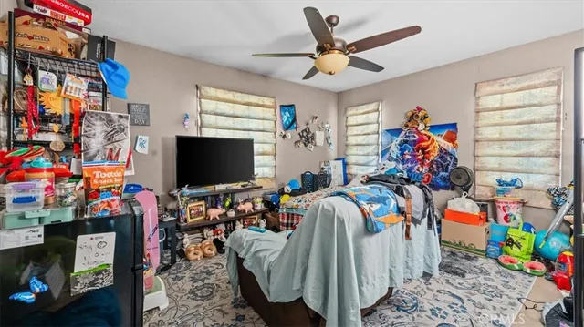 a view of a room with wooden floor and windows
