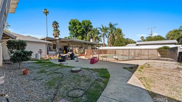 a view of a swimming pool with a patio