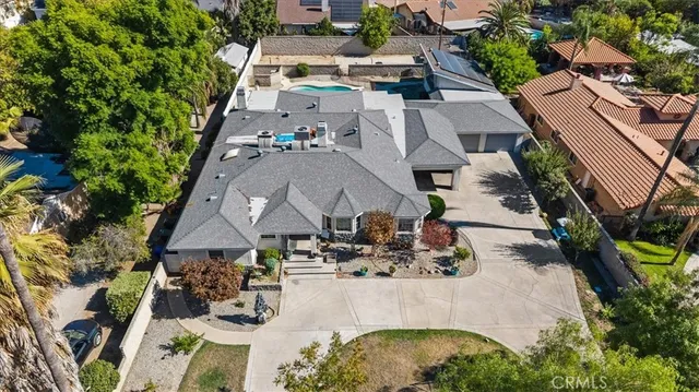 an aerial view of a house with outdoor space