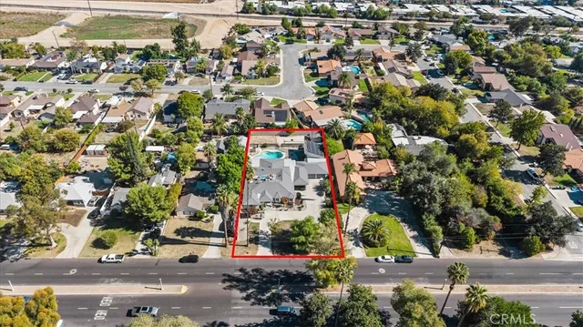 an aerial view of residential houses with outdoor space