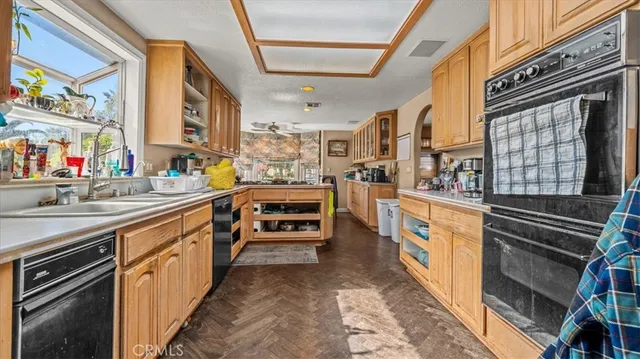 a kitchen with stainless steel appliances and a sink