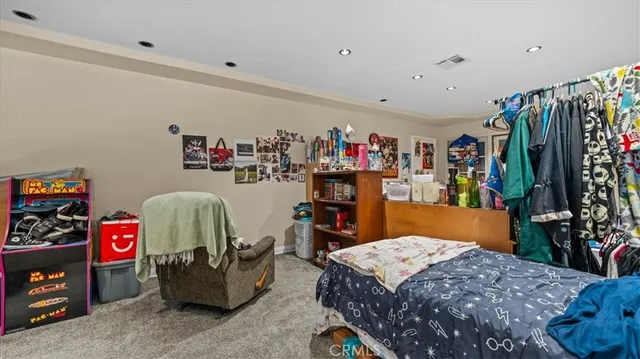 a bed room with a bed and a couch