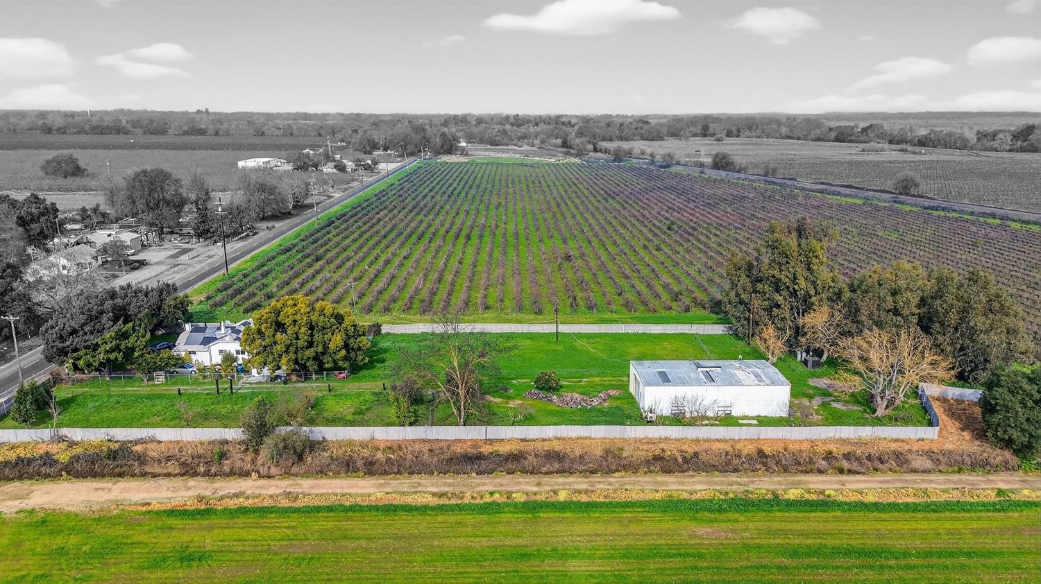27350 Thornton Road Thornton, CA 95632 - Photo 25 of 27 an aerial view of a house with a yard and lake view