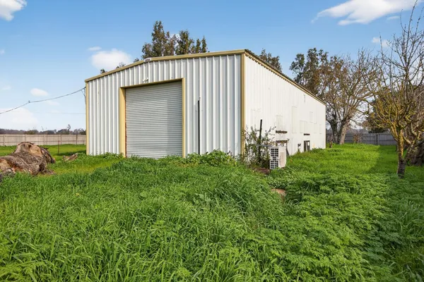 a backyard of a house with lots of green space
