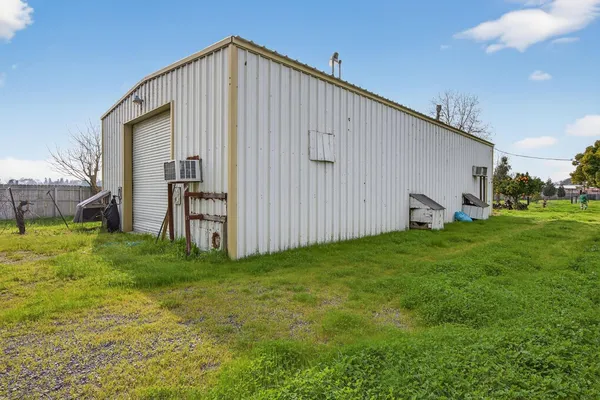 a view of a park with large trees