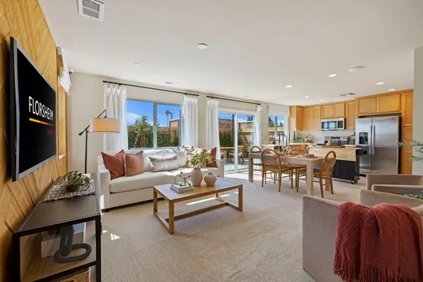 a living room with fireplace furniture and a flat screen tv