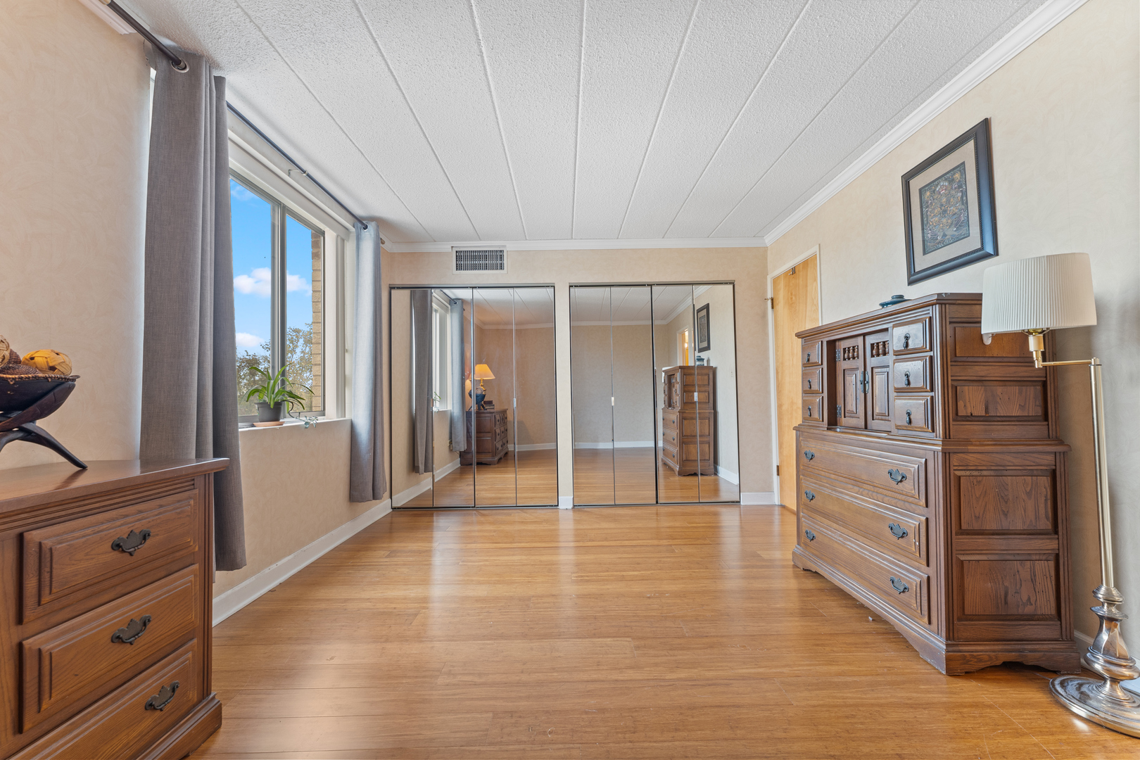 110 West Butterfield Road, Unit 502S Elmhurst, IL 60126 - Photo 11 of 31 a view of an entryway with wooden floor and cabinet