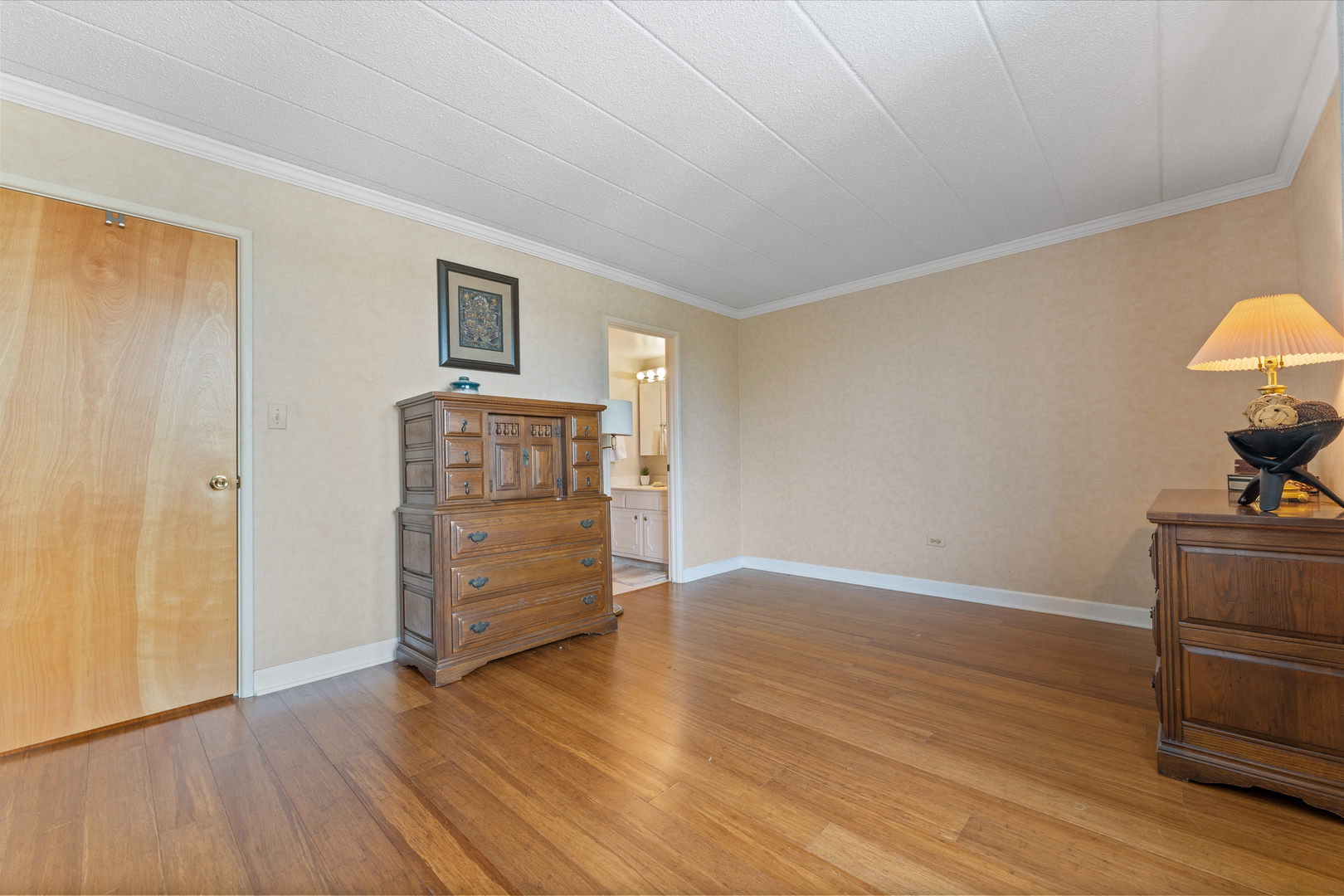110 West Butterfield Road, Unit 502S Elmhurst, IL 60126 - Photo 12 of 31 a view of an empty room with wooden floor and cabinet