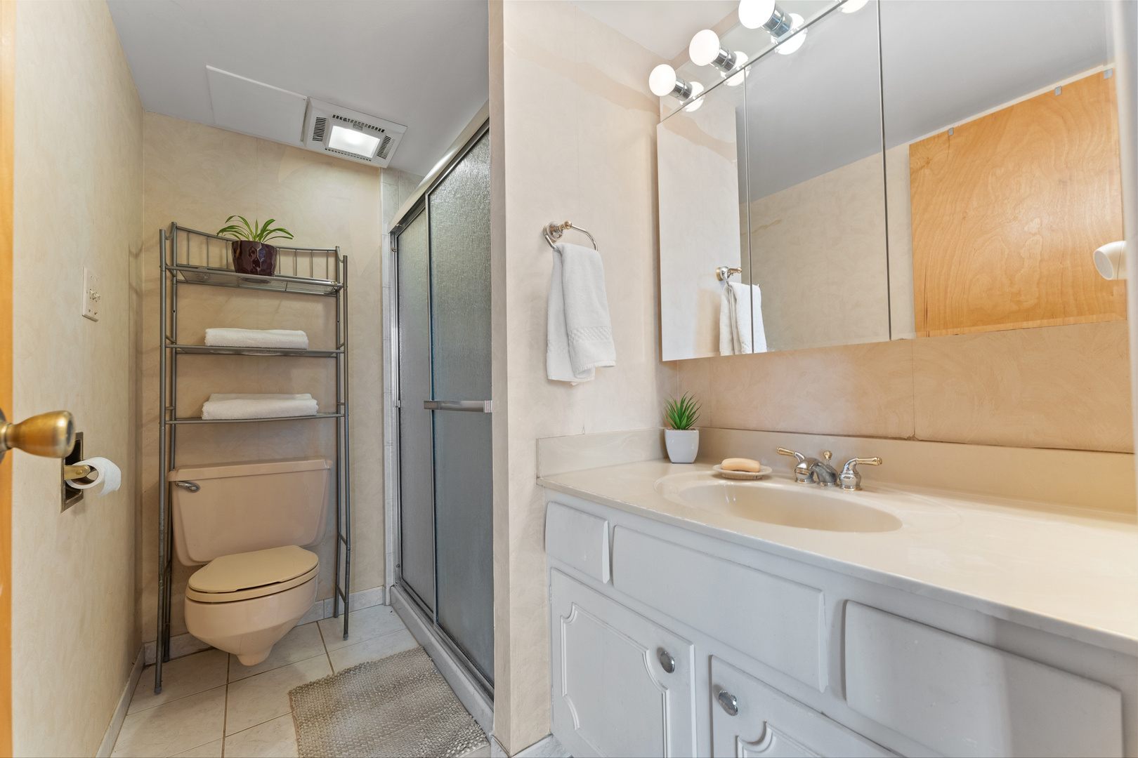 110 West Butterfield Road, Unit 502S Elmhurst, IL 60126 - Photo 13 of 31 a bathroom with a sink a toilet and shower