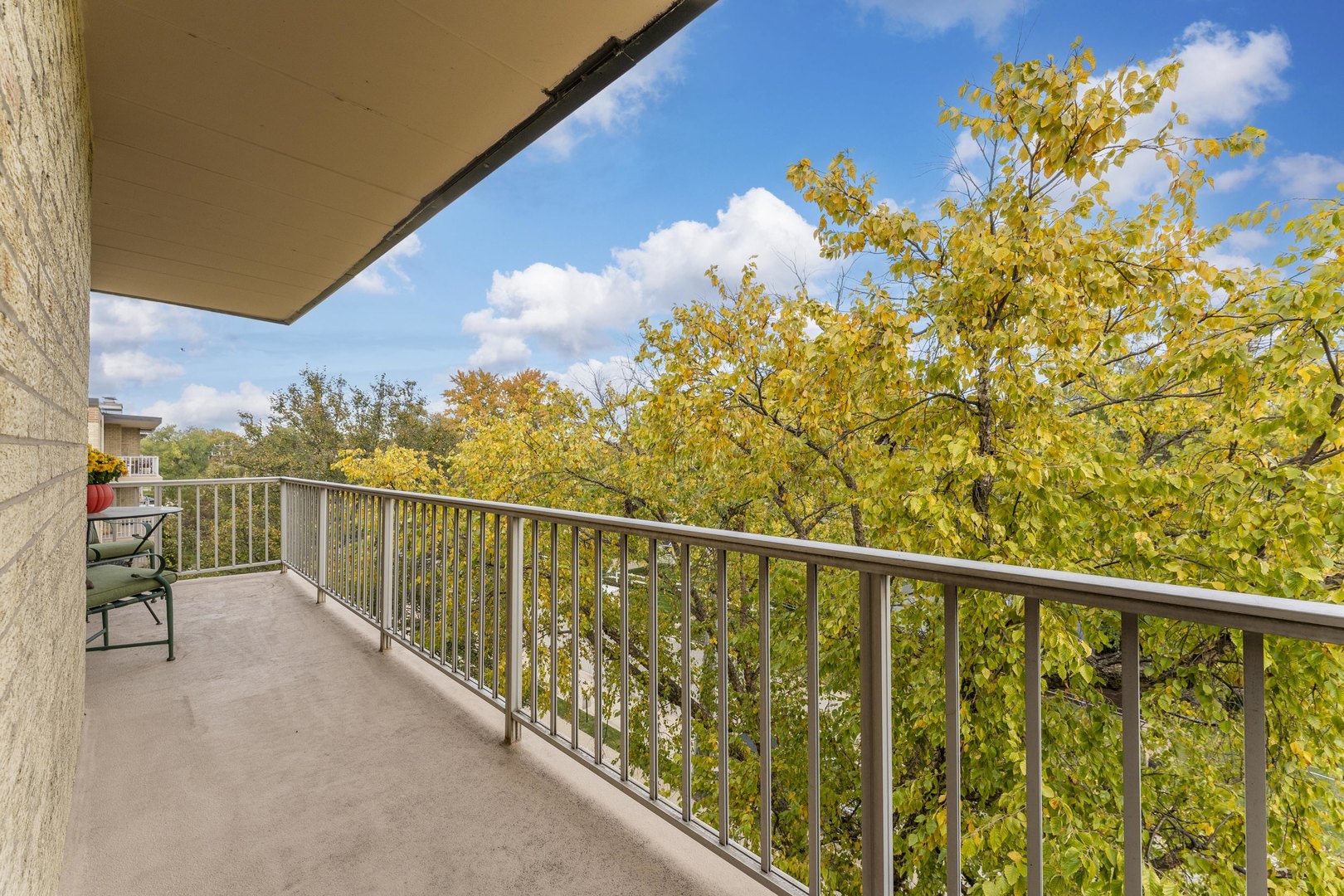 110 West Butterfield Road, Unit 502S Elmhurst, IL 60126 - Photo 18 of 31 a view of a balcony with wooden floor & fence