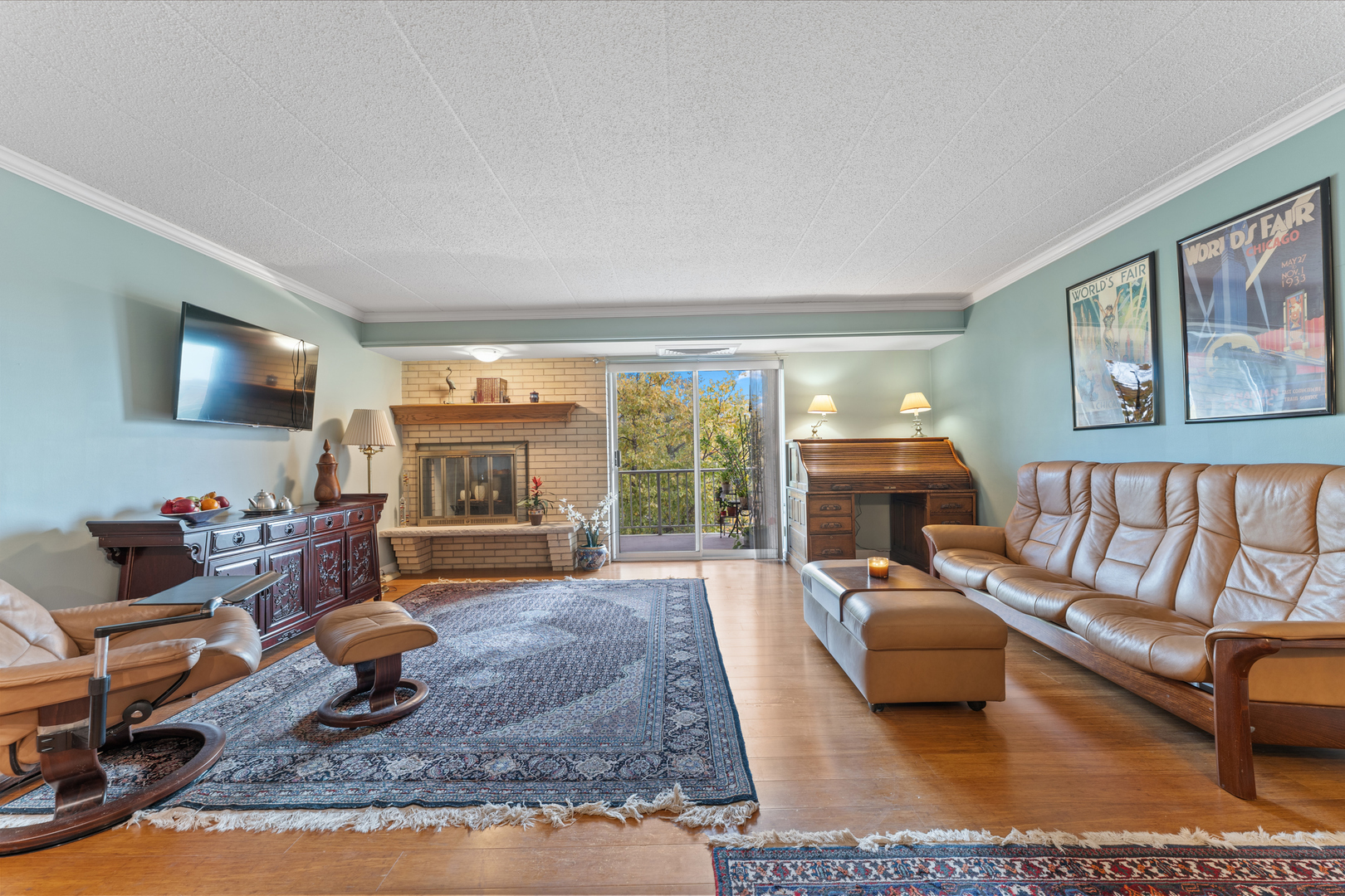 110 West Butterfield Road, Unit 502S Elmhurst, IL 60126 - Photo 2 of 31 a living room with furniture large window and a flat screen tv