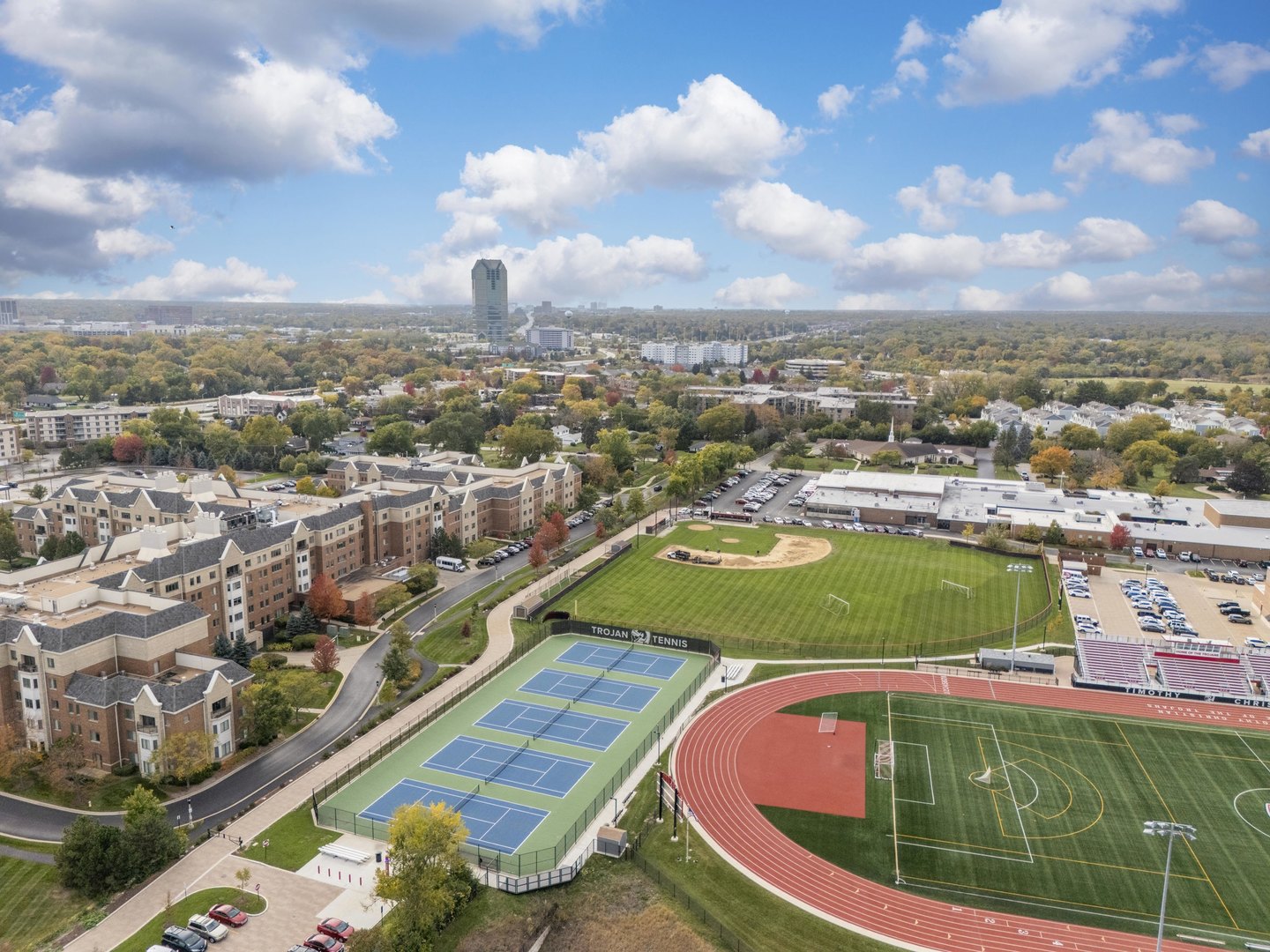 110 West Butterfield Road, Unit 502S Elmhurst, IL 60126 - Photo 25 of 31 a view of a swimming pool with a lot of cars parked