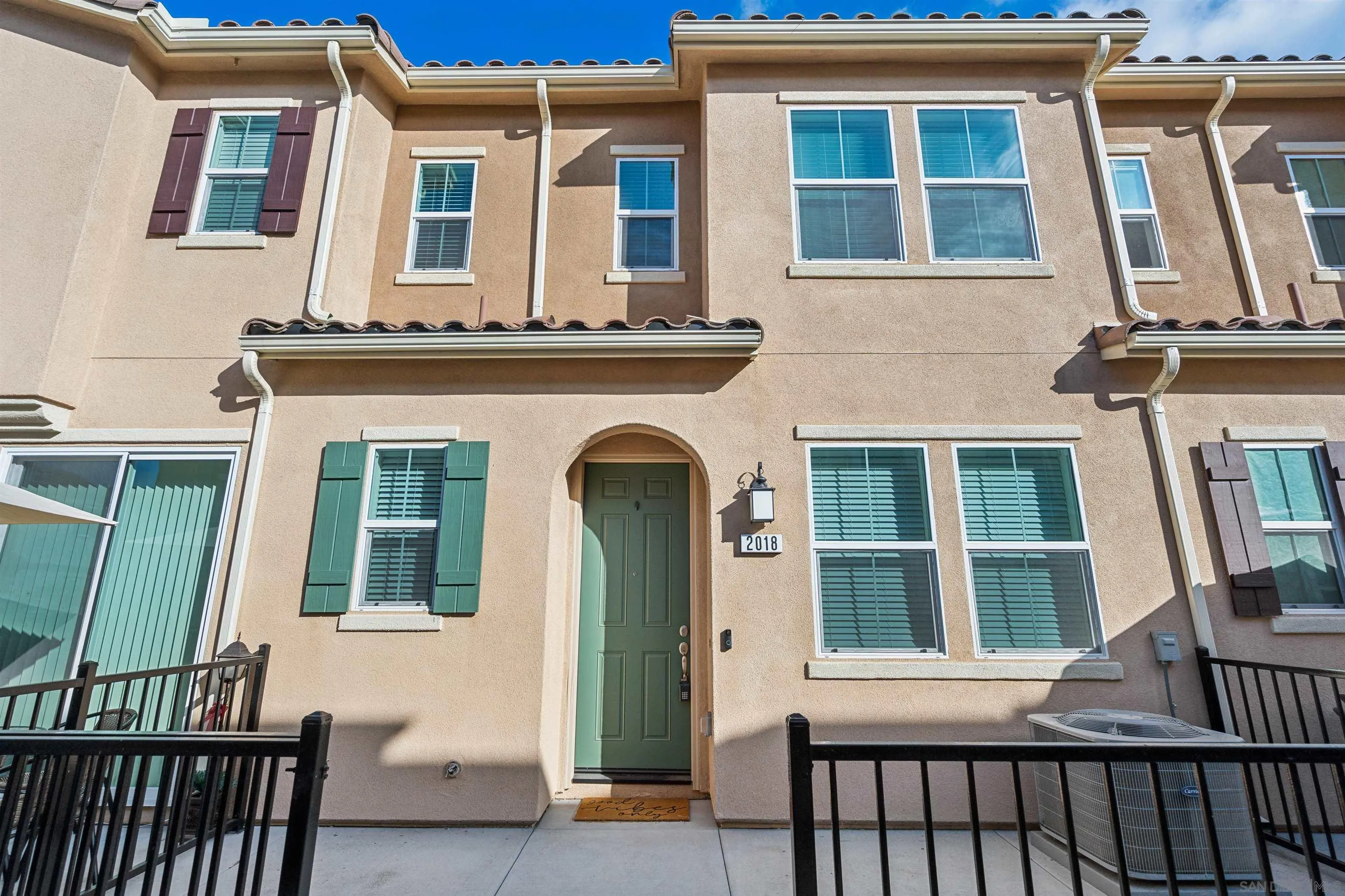 2018 Barite Street Spring Valley, CA 91977 - Photo 4 of 47 a front view of a house with a glass door