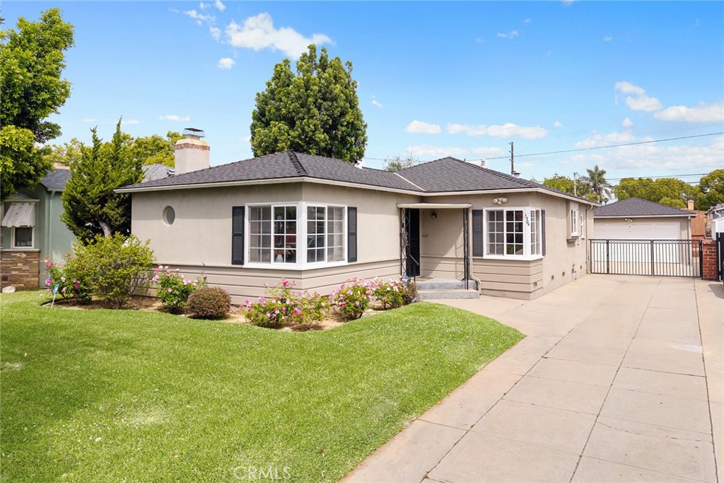 1704 Date Avenue Alhambra, CA 91803 - Photo 1 of 1 a front view of a house with a yard