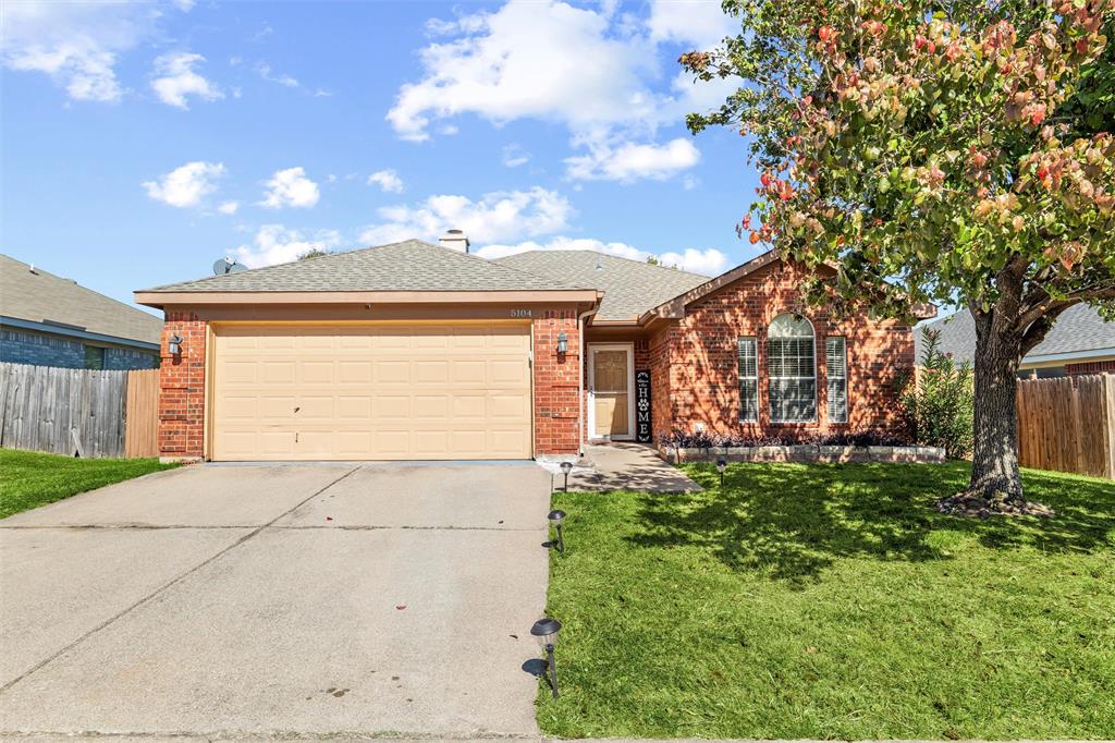 5104 Valley Village Drive Fort Worth, TX 76123 - Photo 1 of 28 a view of a house with a small yard and a large tree