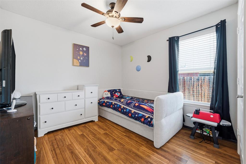 5104 Valley Village Drive Fort Worth, TX 76123 - Photo 15 of 28 a living room with furniture and a flat screen tv