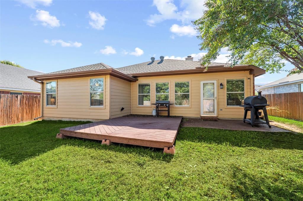 5104 Valley Village Drive Fort Worth, TX 76123 - Photo 22 of 28 a view of a house with a backyard and a patio