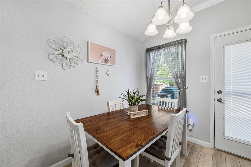 5104 Valley Village Drive Fort Worth, TX 76123 - Photo 8 of 28 a view of a dining room with furniture window and wooden floor