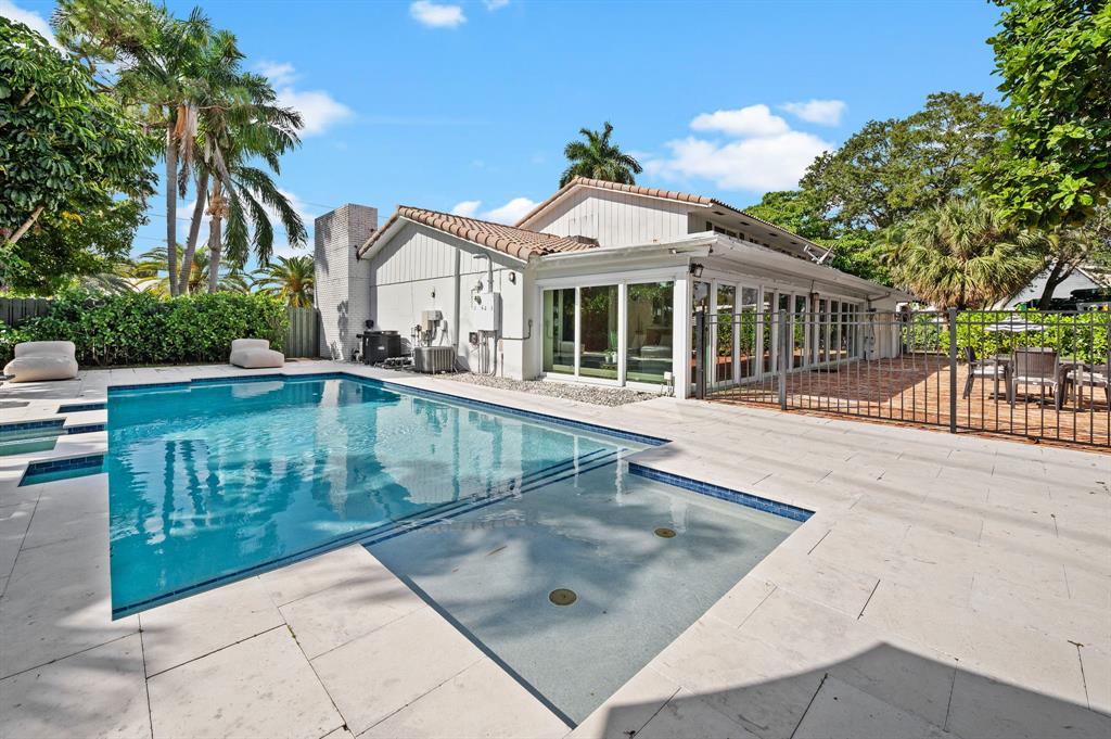 4620 Northeast 25th Avenue Fort Lauderdale, FL 33308 - Photo 1 of 30 a view of a house with a swimming pool