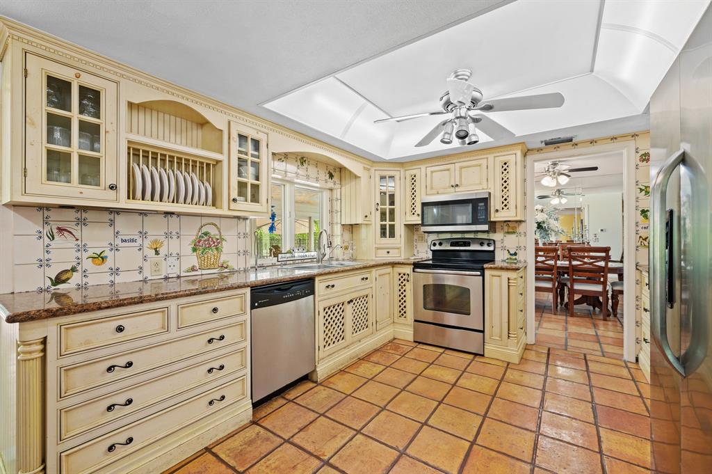 4620 Northeast 25th Avenue Fort Lauderdale, FL 33308 - Photo 14 of 30 a kitchen with stainless steel appliances a stove a sink and a refrigerator