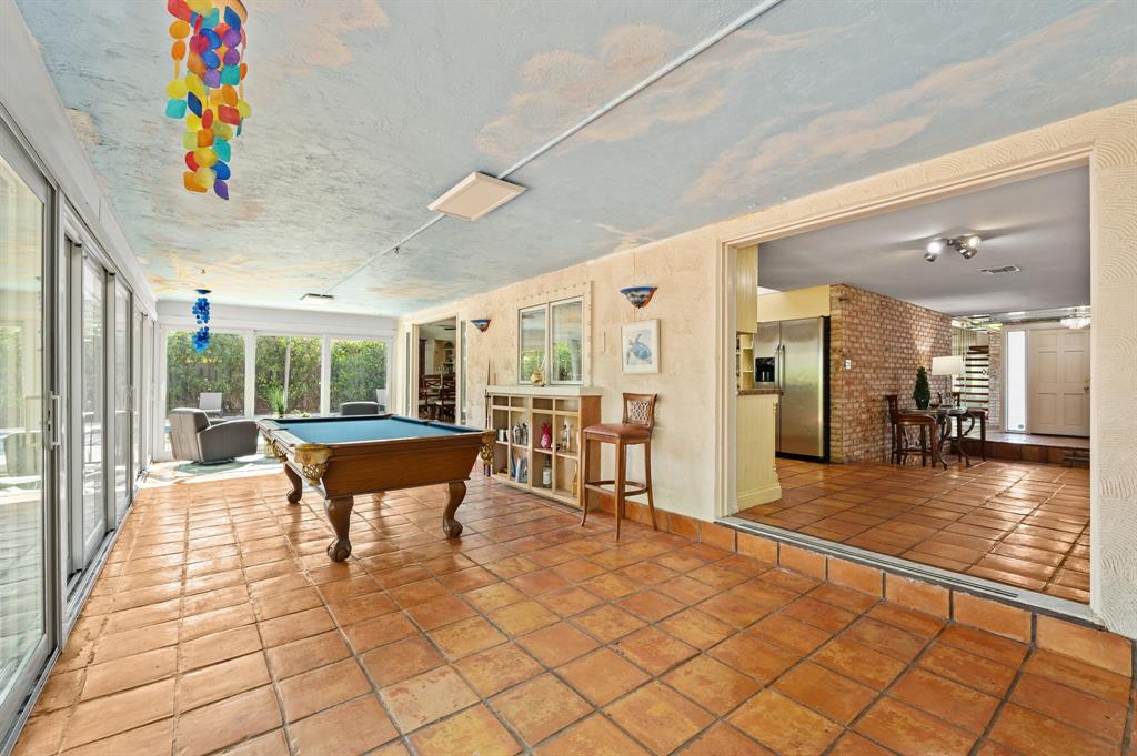 4620 Northeast 25th Avenue Fort Lauderdale, FL 33308 - Photo 16 of 30 a dining room with furniture and a floor to ceiling window