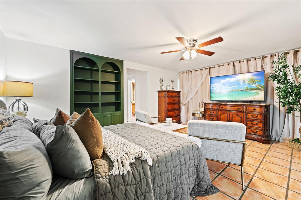 4620 Northeast 25th Avenue Fort Lauderdale, FL 33308 - Photo 19 of 30 a bedroom with a bed and a flat screen tv