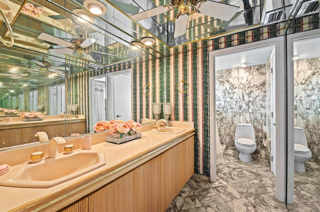 4620 Northeast 25th Avenue Fort Lauderdale, FL 33308 - Photo 20 of 30 a bathroom with a sink a toilet and shower curtain