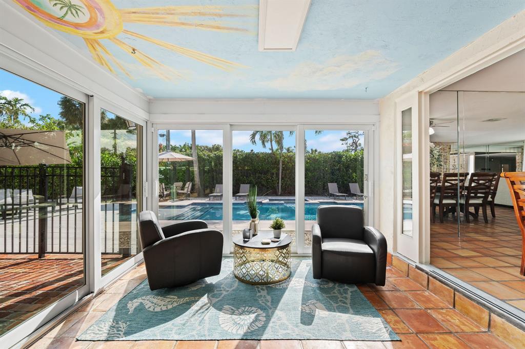 4620 Northeast 25th Avenue Fort Lauderdale, FL 33308 - Photo 7 of 30 a living room with furniture large windows and wooden floor