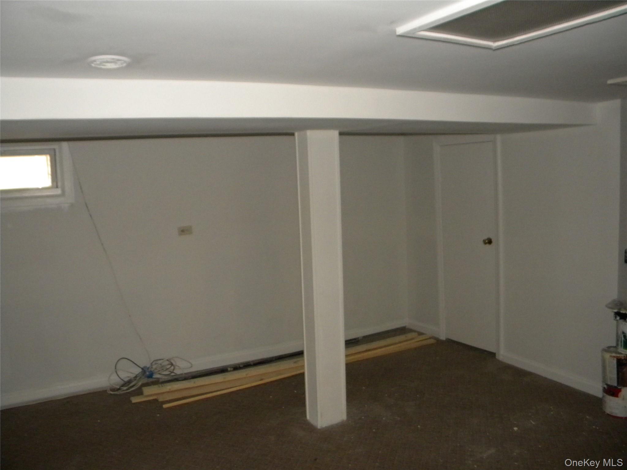 241-26 86th Road Queens, NY 11426 - Photo 27 of 38 an empty room with a empty space