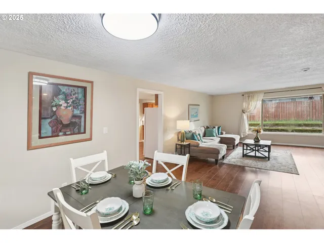 a living room with furniture and a table