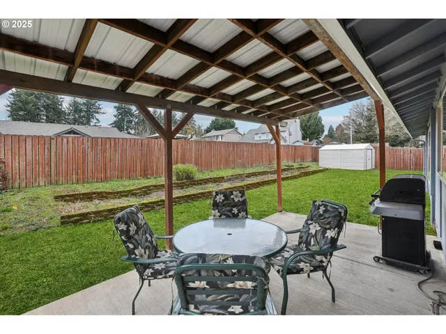 a view of a porch with chairs and a table