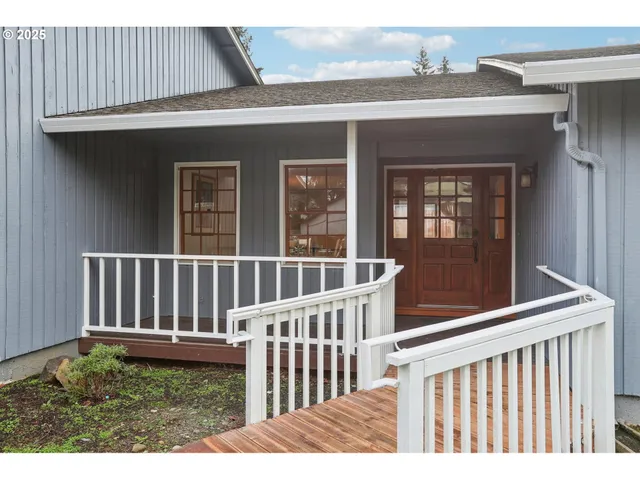 a view of a brick house with a small yard