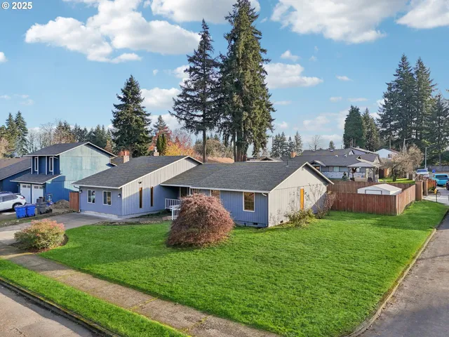 a view of a patio with table and chairs potted plants with wooden fence