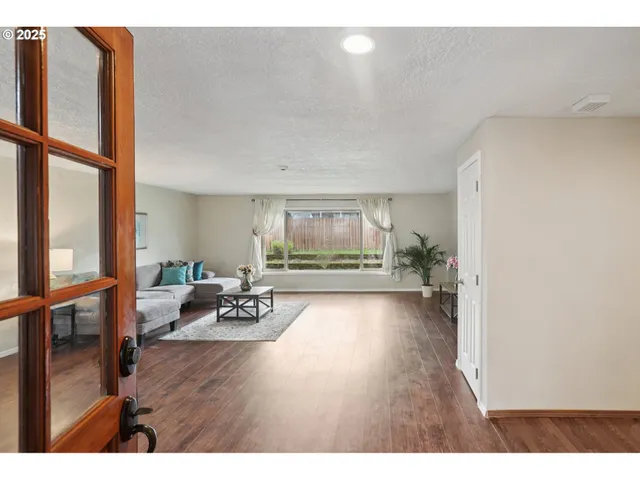view of living room with furniture and large window