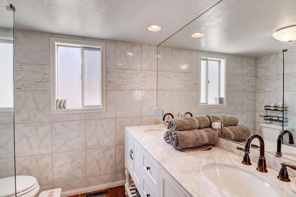 11615 Legendale Drive Lakeside, CA 92040 - Photo 14 of 33 a bathroom with a double vanity sink and a bathtub