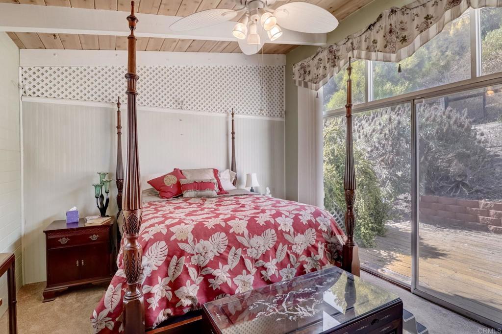 11615 Legendale Drive Lakeside, CA 92040 - Photo 16 of 33 a bedroom with a bed and a window