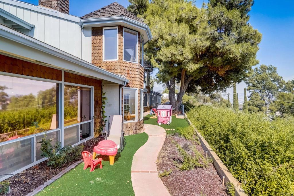 11615 Legendale Drive Lakeside, CA 92040 - Photo 27 of 33 a front view of a house with a yard table and chairs