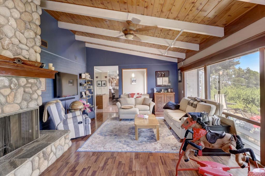 11615 Legendale Drive Lakeside, CA 92040 - Photo 3 of 33 a living room with patio fireplace furniture and a large window