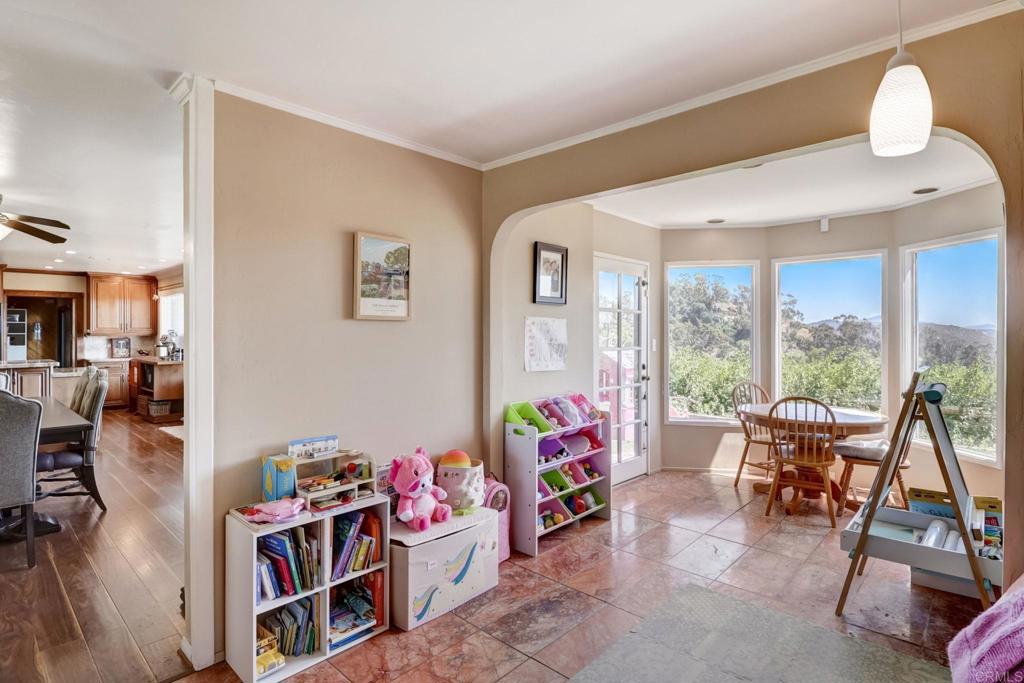 11615 Legendale Drive Lakeside, CA 92040 - Photo 8 of 33 a playing room with furniture and a book shelf