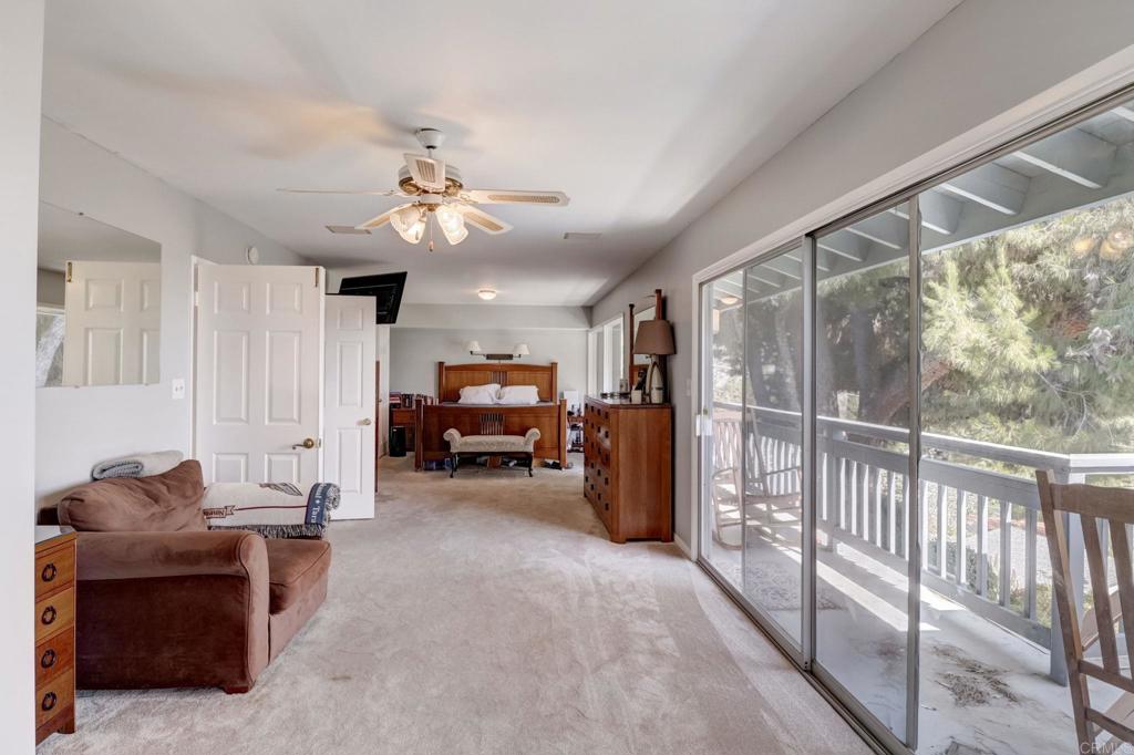 11615 Legendale Drive Lakeside, CA 92040 - Photo 9 of 33 a living room with furniture a ceiling fan and a window