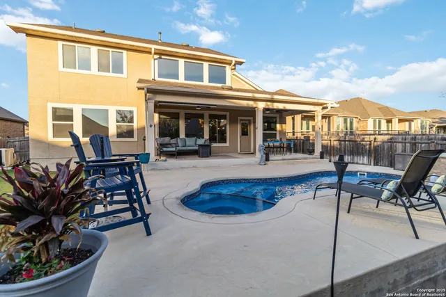 a view of a house with sitting area and furniture