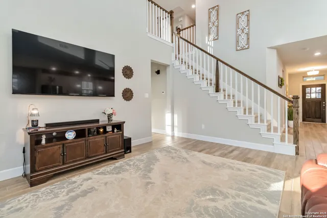 a view of an entryway with wooden floor