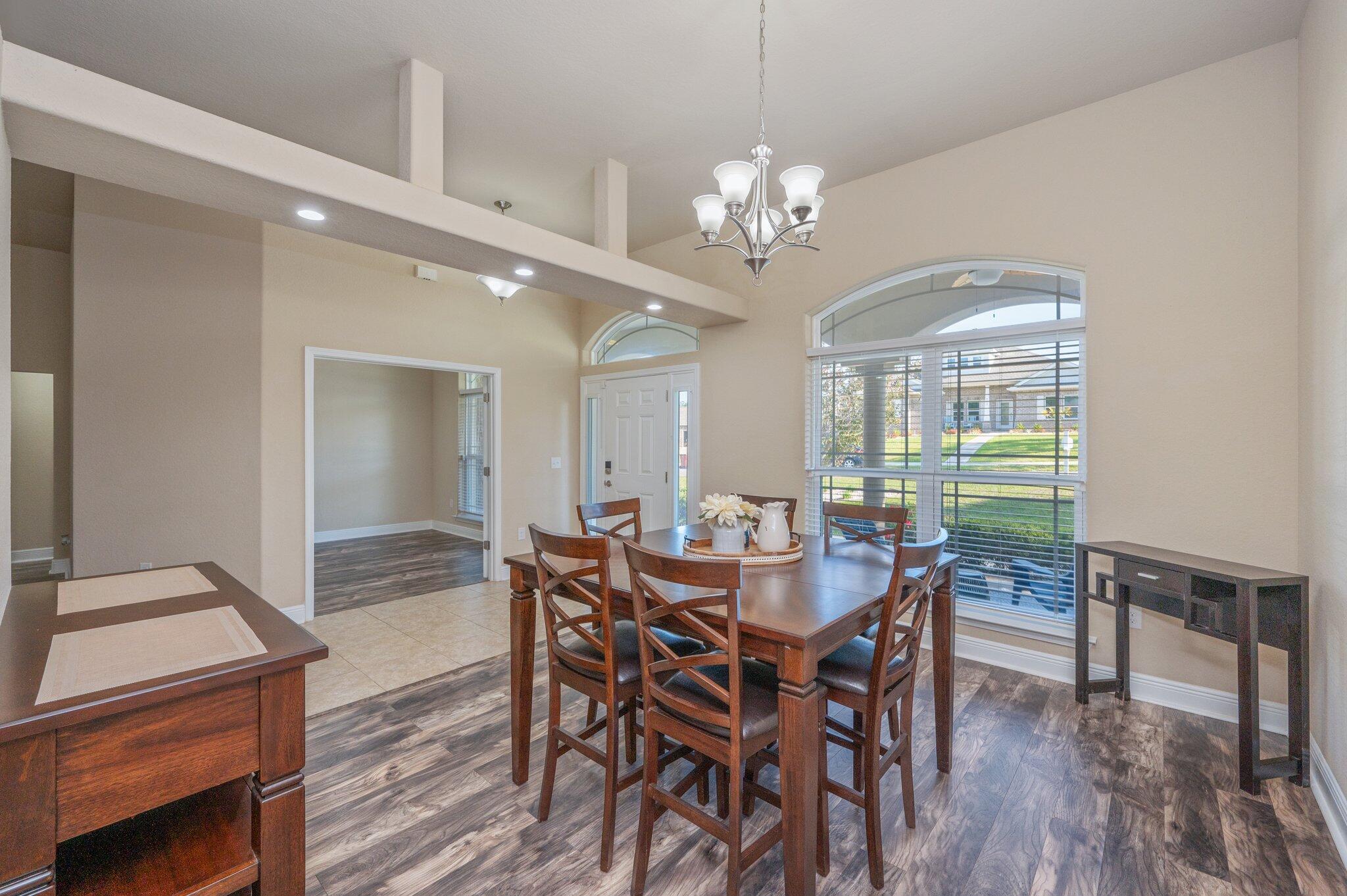 513 Vale Loop Crestview, FL 32536 - Photo 29 of 50 a view of a dining room with furniture window and wooden floor