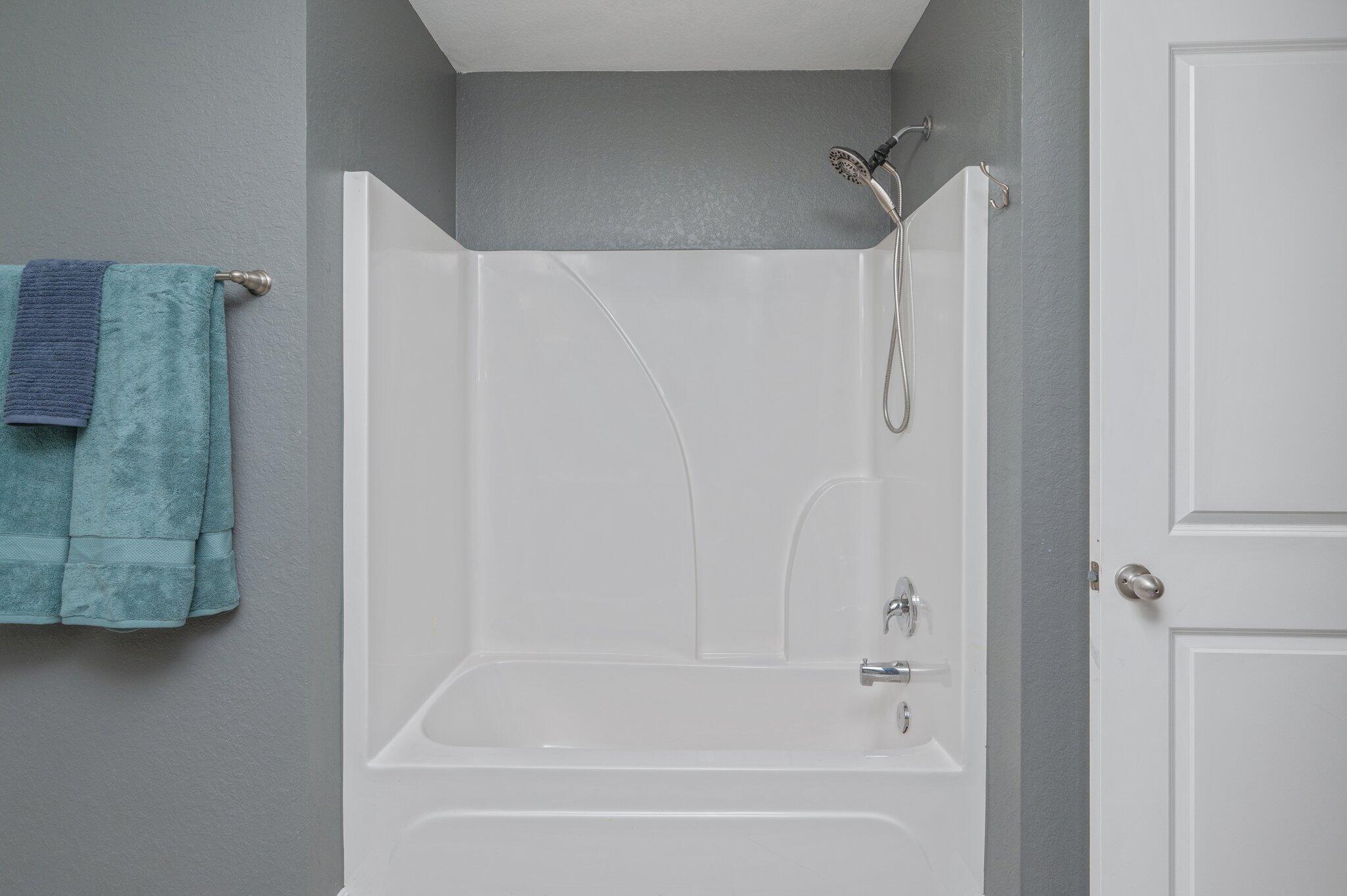 513 Vale Loop Crestview, FL 32536 - Photo 41 of 50 a bathroom with a bathtub and a shower