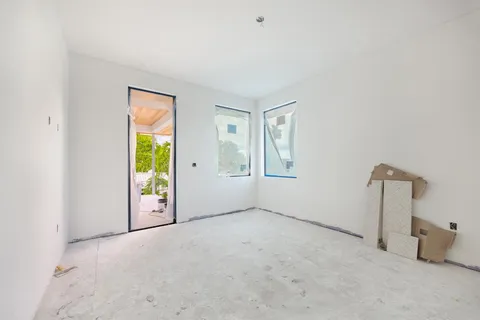 a view of a livingroom with furniture and a window