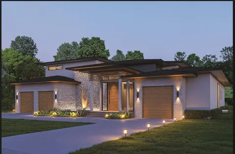 a front view of house with yard and outdoor seating